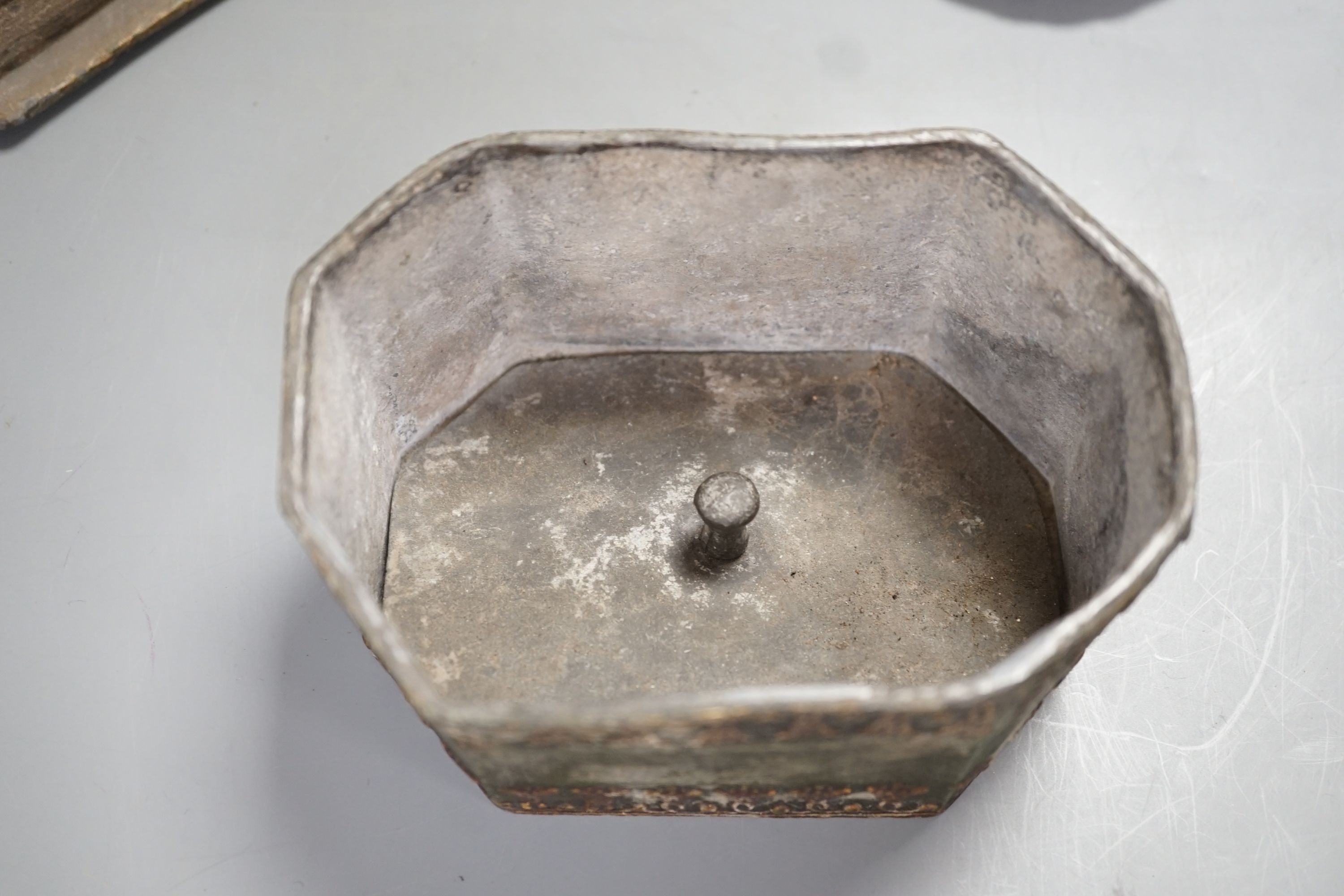 A Regency octagonal lead tobacco box, weight and cover, with slave-head finial, 14cm tall, and late Victorian silver cigarette holder